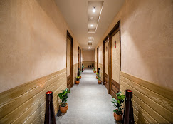 Wood-panelled hallway with plants