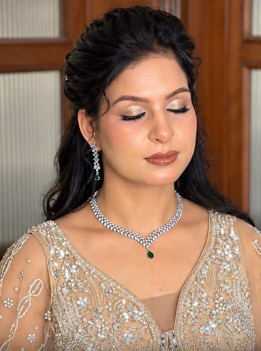 Soft glam engagement look with a diamond necklace