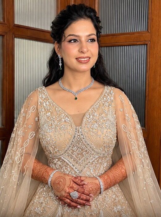 Engagement look in a champagne embellished gown